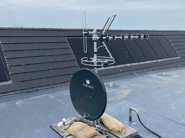 Communal TV aerial and satellite dish installation on a flat roof