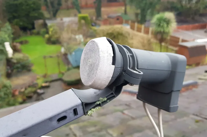 Close-up of a faulty Sky satellite dish LNB requiring replacement to restore reliable reception.